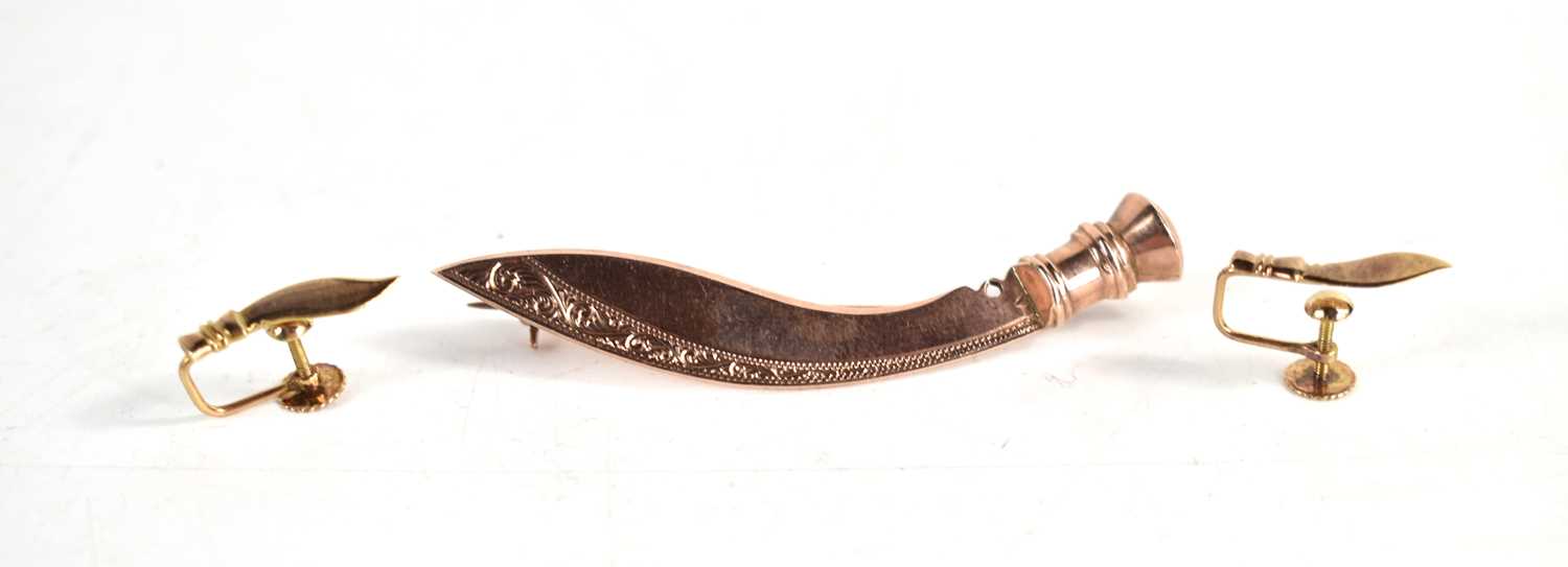 Lot 273 - A 9ct gold brooch in the form of a Kukri knife,...