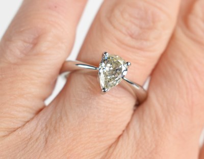 Lot 286 - A platinum solitaire pear cut diamond ring,...