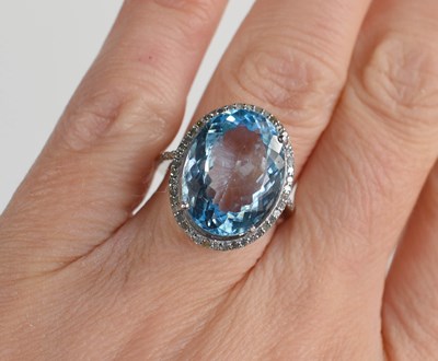 Lot 287 - A silver dress ring set with a large oval blue...