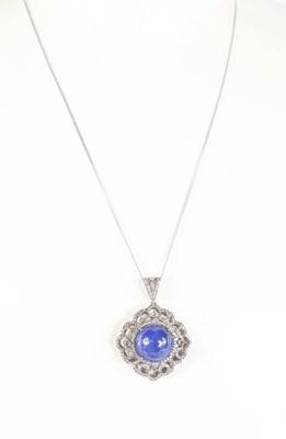 Lot 295 - A silver, tanzanite and diamond pendant...