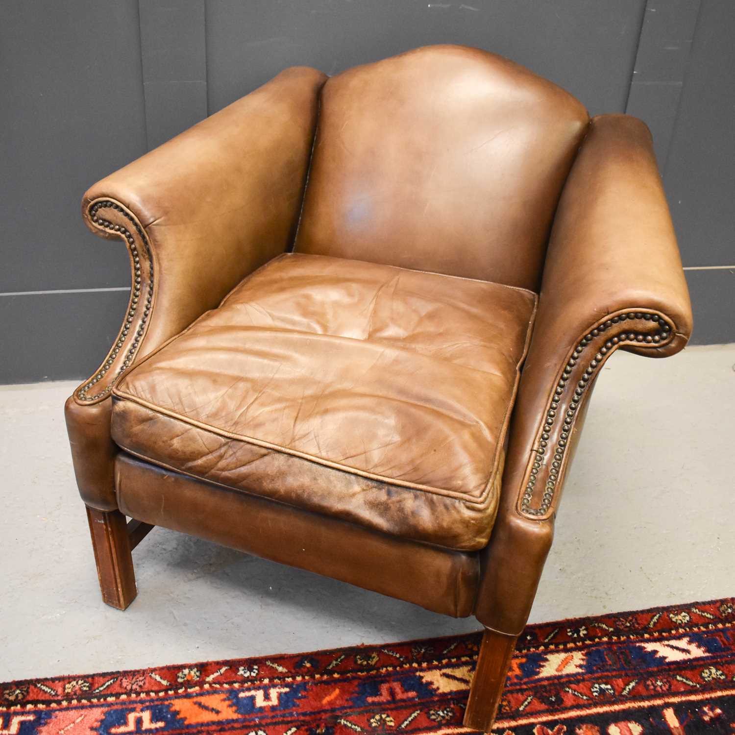 Lot 527 - A modern leather armchair.