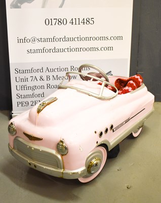Lot 105 - A 20th century 1940s childs pink pedal car.