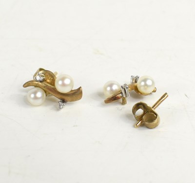 Lot 22 - A 9ct gold, pearl and diamond set pendant...