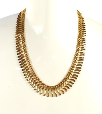 Lot 32 - An 18ct gold necklace, composed of graduated...