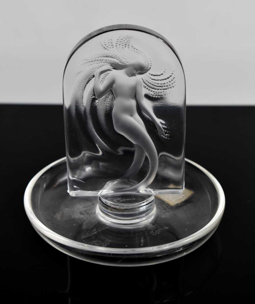 Lot 149 - A Lalique glass ring tray with lady within an...