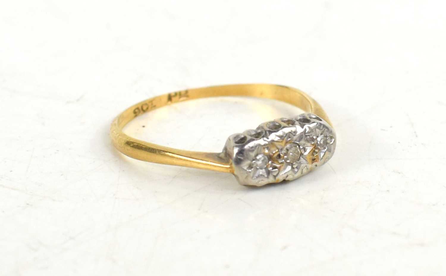 Lot 89 - A 9ct gold and diamond ring, three chip...