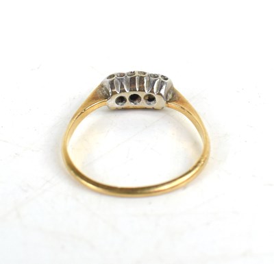 Lot 89 - A 9ct gold and diamond ring, three chip...