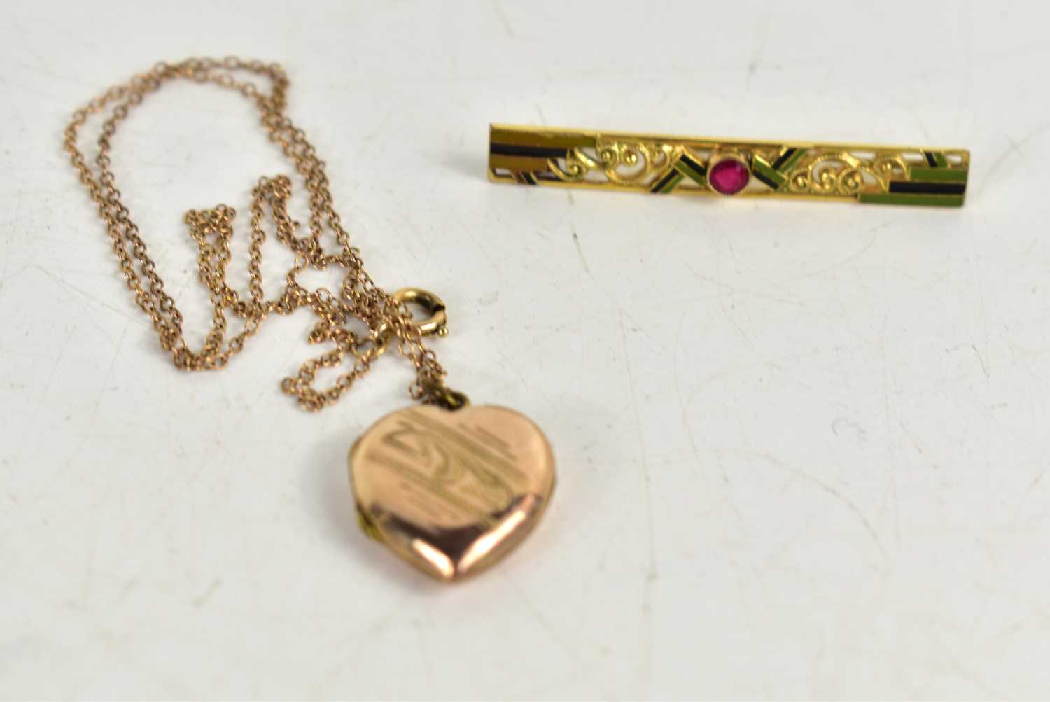 Lot 19 - A 9ct gold front and back heart form pendant...