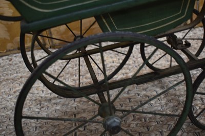 Lot 96 - A Victorian doll's pram c. 1890 with green...