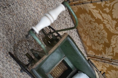 Lot 96 - A Victorian doll's pram c. 1890 with green...