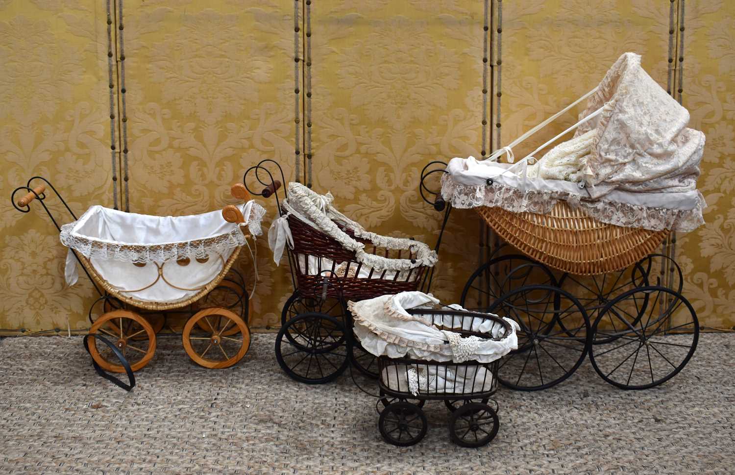 Lot 52 - Four 20th century Victorian-style dolls prams...