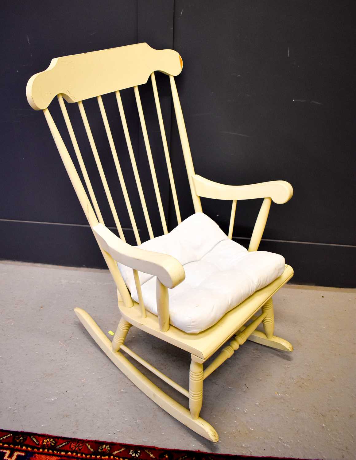 Lot 521 - An antique pine painted kitchen rocking chair...