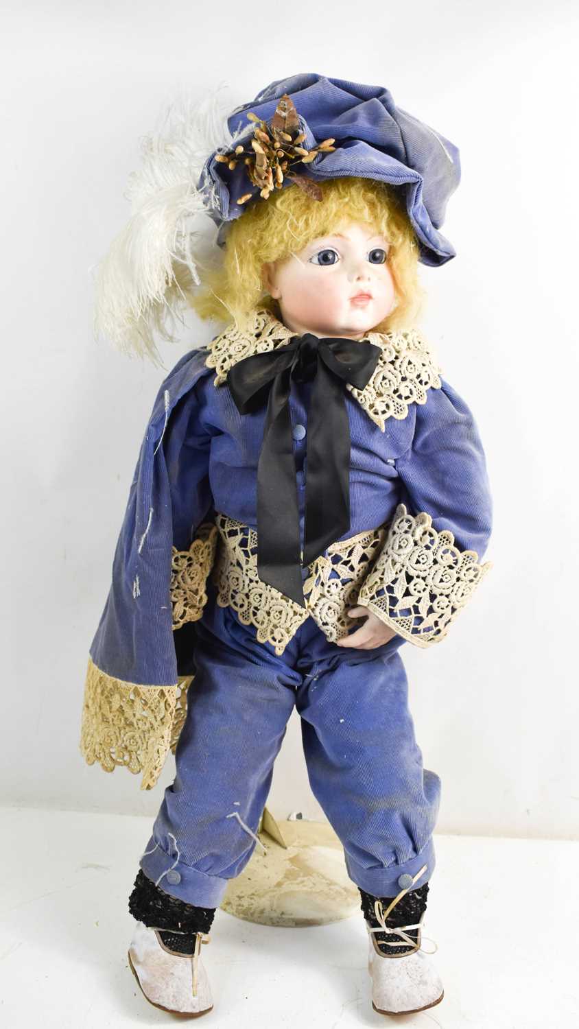 Lot 35 - A German bisque head doll, with blue chord...