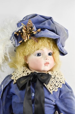 Lot 35 - A German bisque head doll, with blue chord...