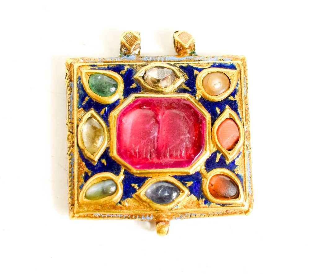 Lot 14 - An Indian Mughal gold & enamel amulet pendant,...