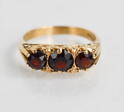 Lot 95 - An antique 9ct gold and garnet ring, the three...