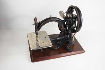 Lot 412 - A Vintage Wilcox and Gibbs hand crank sewing...