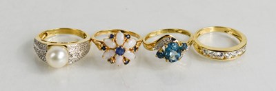 Lot 65 - A 9ct gold, blue topaz and diamond ring,...