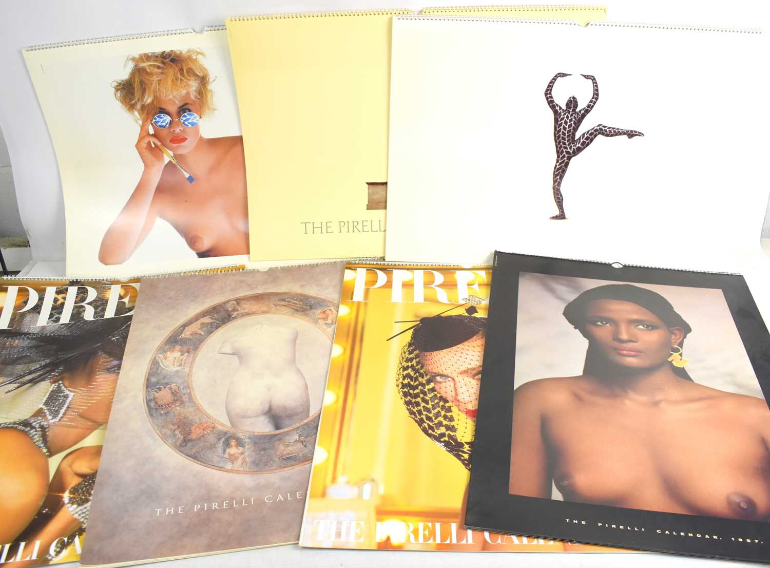 Lot 432 - A group of seven vintage Pirelli calendars...