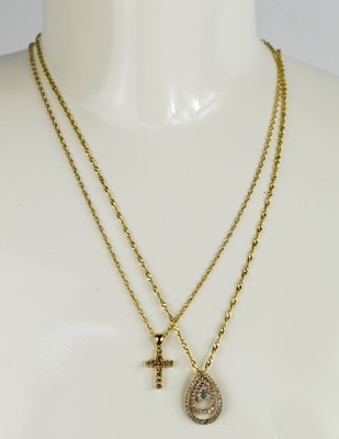 Lot 121 - Two 9ct gold necklace, one with a cruciform...