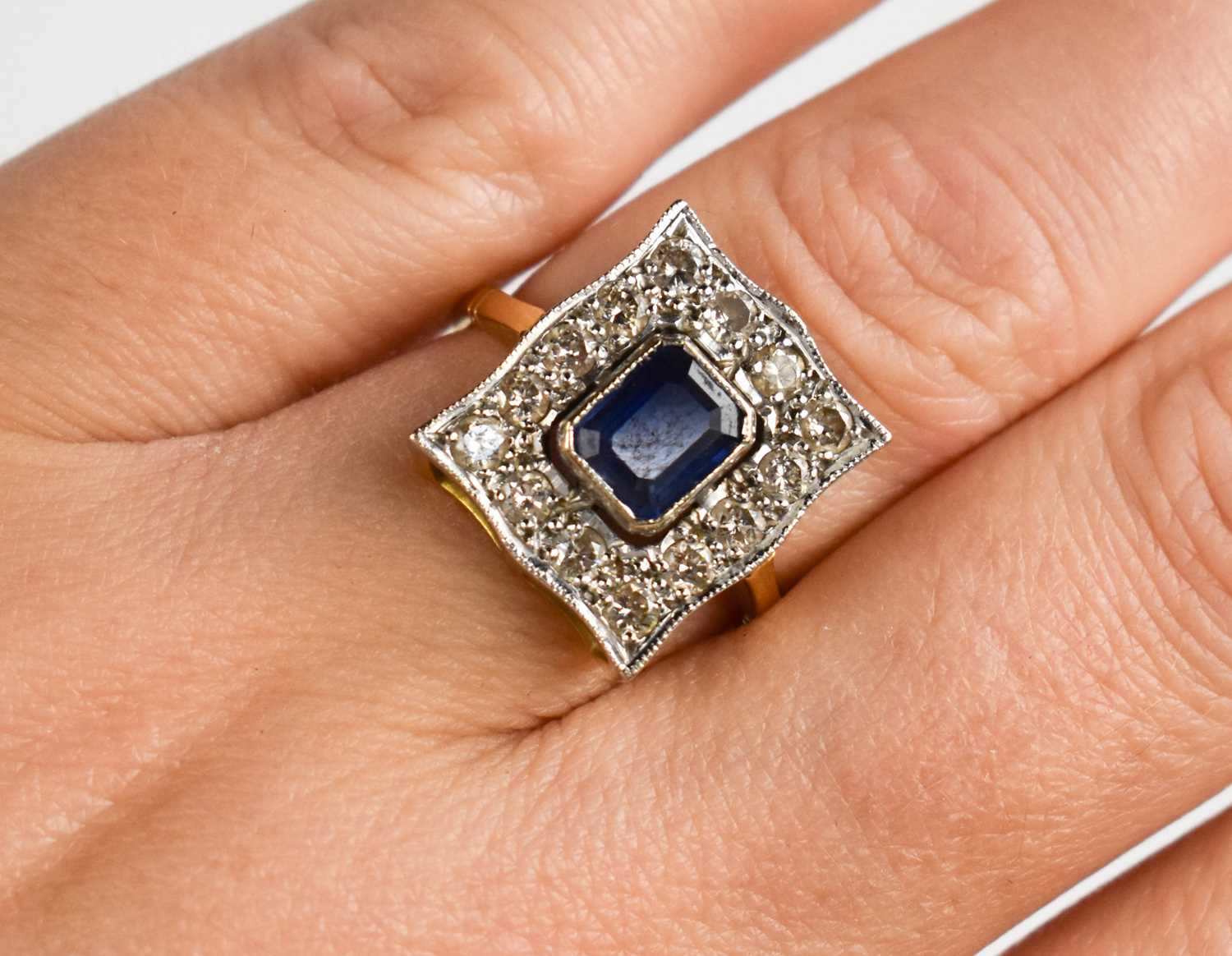 Lot 75 - An 18ct gold, platinum, diamond and sapphire...