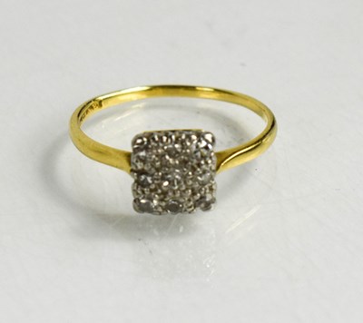 Lot 156 - An 18ct gold and diamond ring, the nine...