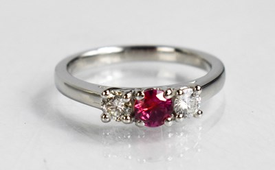 Lot 99 - A platinum, pink sapphire and diamond trilogy...