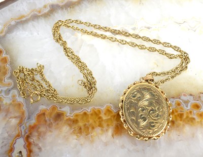 Lot 230 - A 9ct gold locket pendant engraved with...