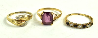 Lot 211 - Three 9ct gold rings comprising a sapphire and...