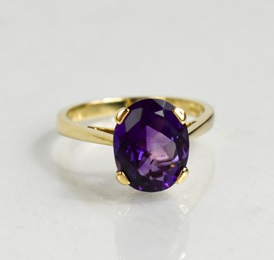 Lot 49 - A 9ct gold and amethyst cocktail ring, in a...