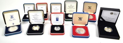 Lot 297 - A collection of cased silver coins to include...