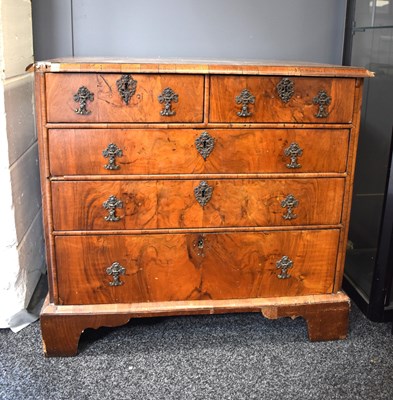 Lot 559 - An 18th century walnut veneered chest of...