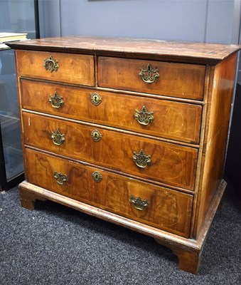 Lot 564 - A Queen Anne period walnut veneered chest of...