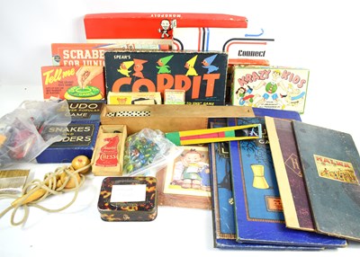 Lot 411 - A group of vintage toys to include marbles,...