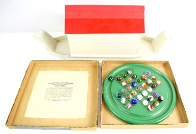 Lot 412 - A boxed Chad Valley solitaire board with...