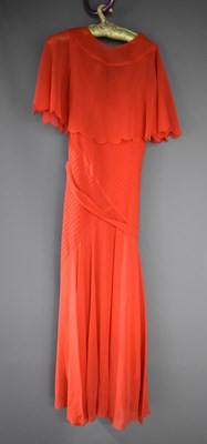 Lot 170 - A vintage coral evening dress with belt and...
