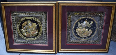 Lot 469 - Two framed and glazed Burmese kalaga wall...