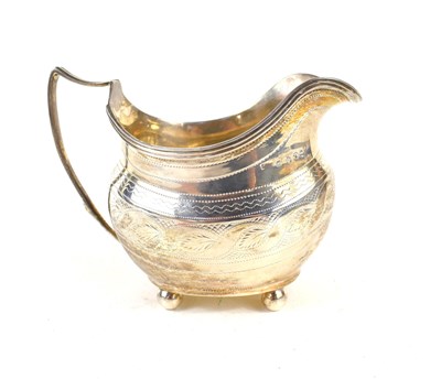 Lot 250 - A George III silver cream jug of oval bellied...