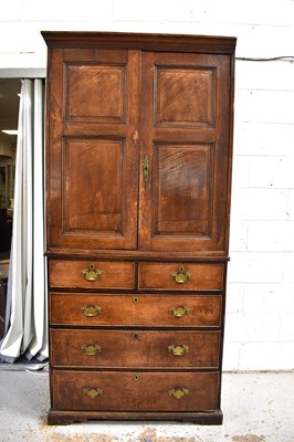Lot 562 - An 18th century oak linen press, the pair of...