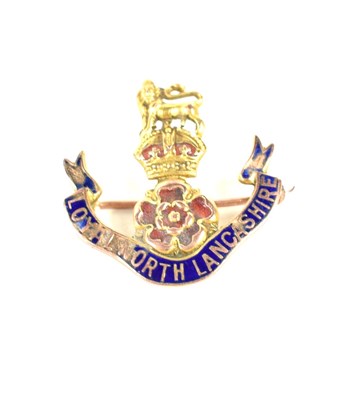 Lot 217 - A 9ct gold and enamel Regimental badge for...