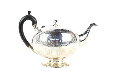 Lot 268 - A Georgian silver teapot, engraved with chased...