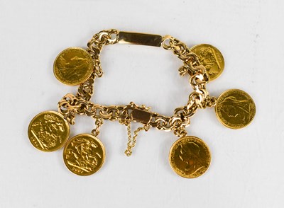Lot 29 - A 14ct gold ID bracelet fitted with six half...