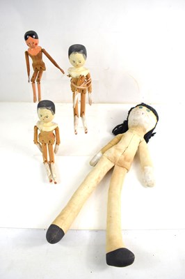Lot 404 - A group of vintage naive peg dolls, possibly...