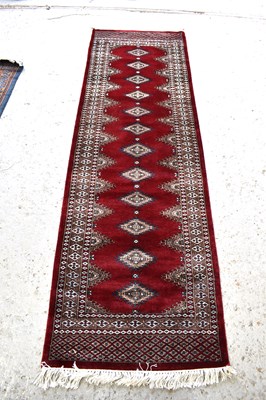 Lot 511 - An Indian tribal wool runner, with deep red...