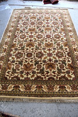 Lot 512 - A Mughal tribal wool rug, with ivory ground...