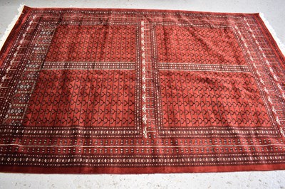 Lot 514 - An Indian tribal wool rug, with red ground and...