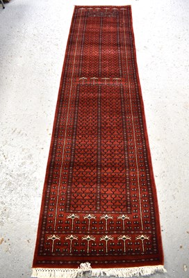 Lot 507 - An Indian tribal wool runner, with red-orange...