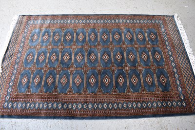 Lot 513 - An Indian tribal wool rug, with dark blue-grey...