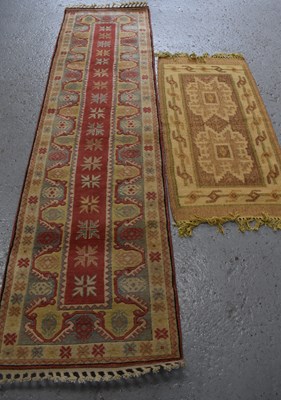 Lot 504 - Two Middle Eastern cream ground rugs, the...