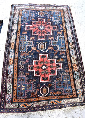 Lot 503 - A Middle Eastern wool rug, the pattern of...